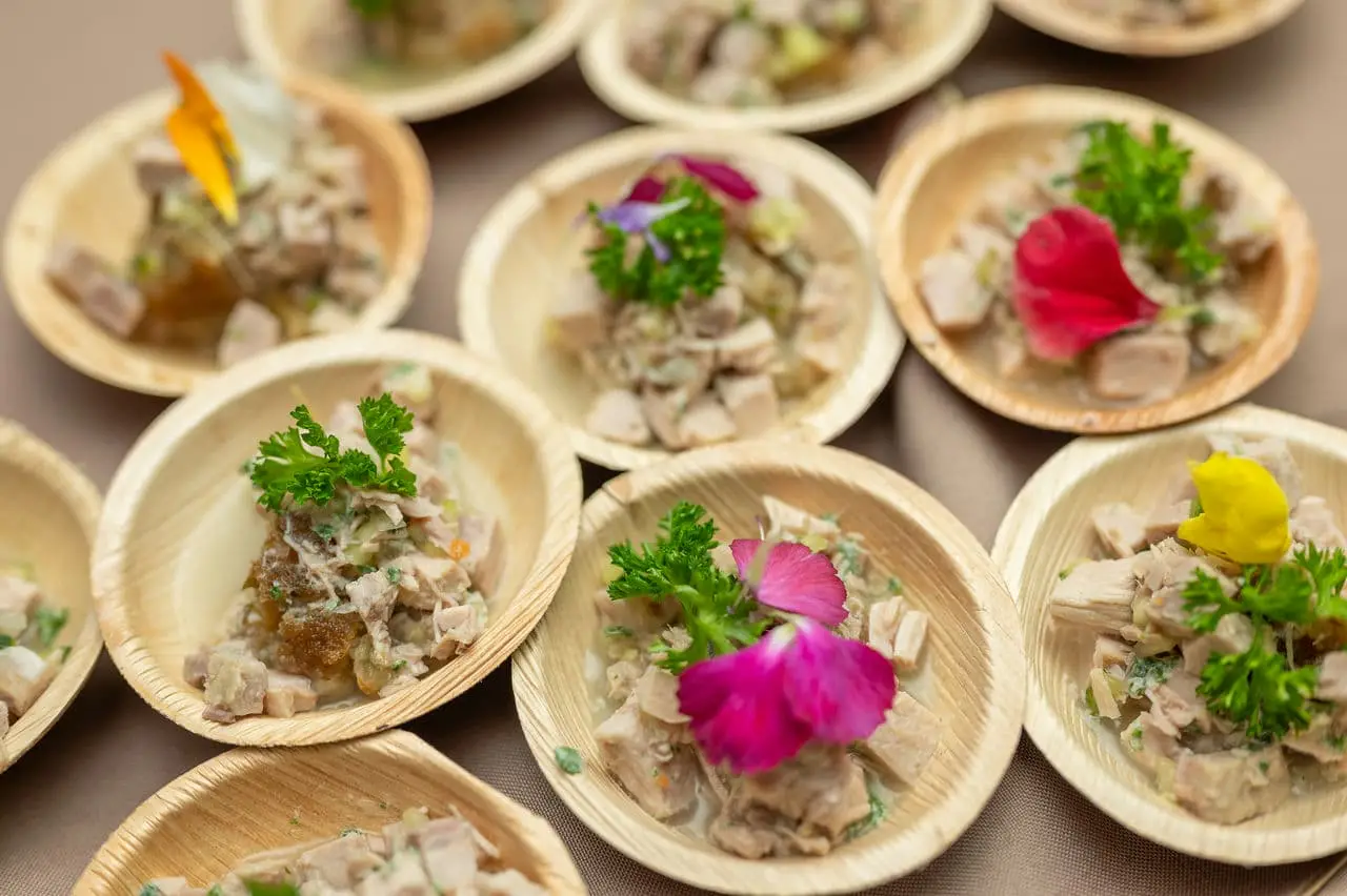 Several wooden bowls of cuisine from barbados