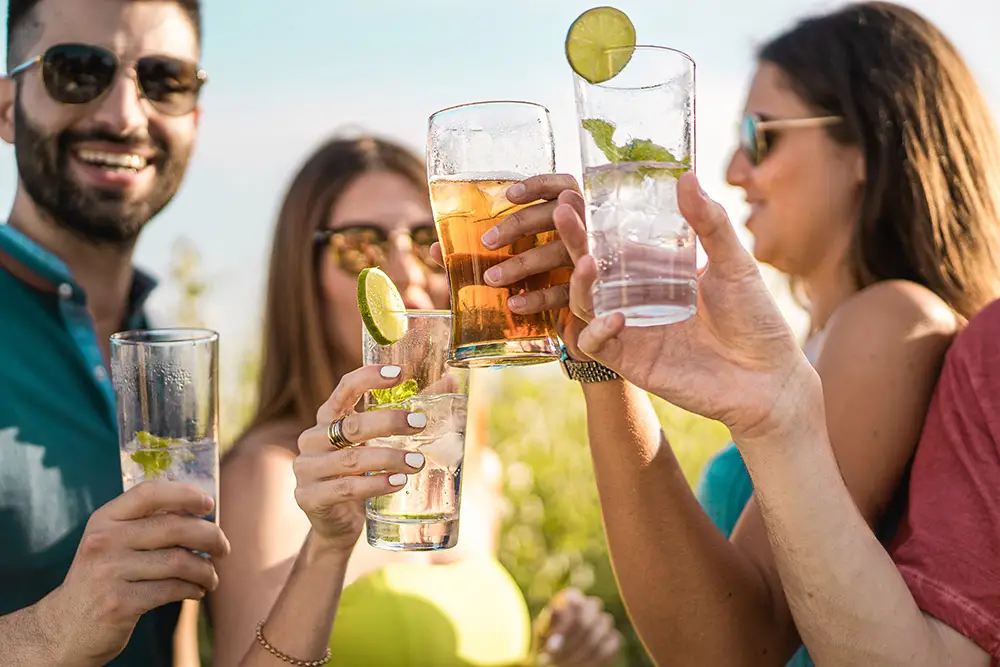 Friends enjoying drinks at a rooftop bar