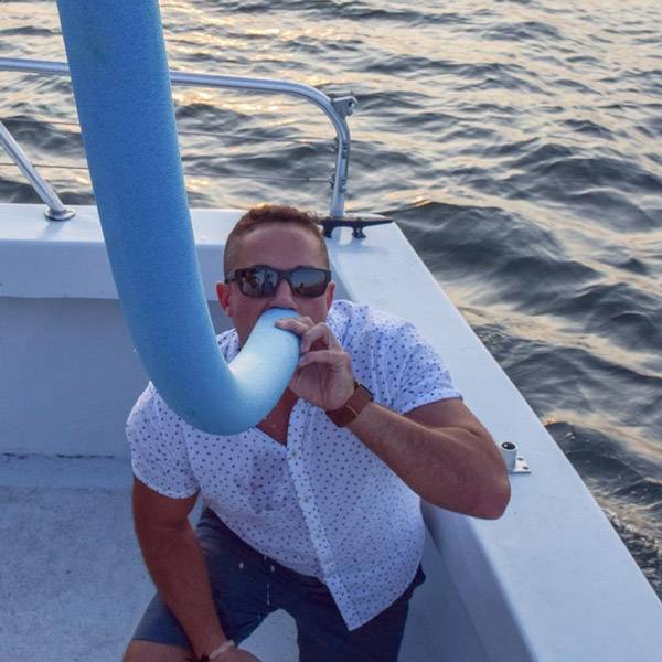 Drinking a shot through a pool noodle